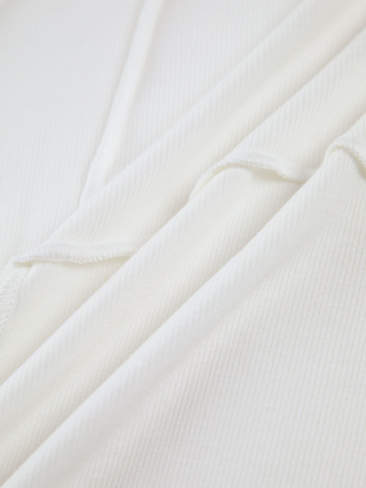 Freja | Elegant ribbestrikket langermet topp med skreddersydd piping
